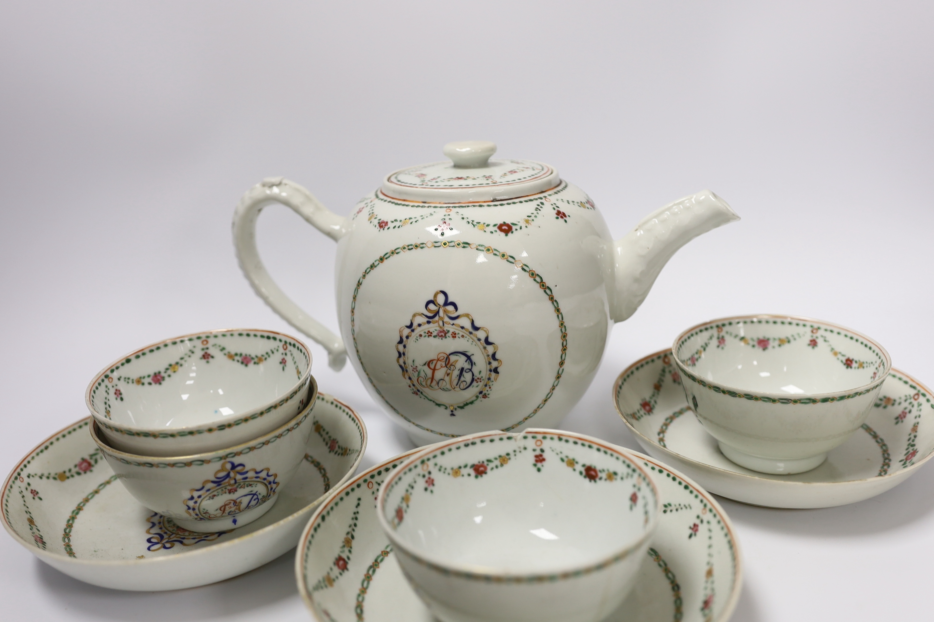 A Chinese export famille rose teapot, four tea bowls and three saucers, all Jiaqing period